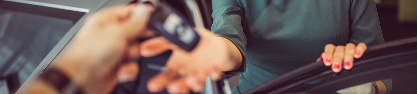 Woman getting keys to car